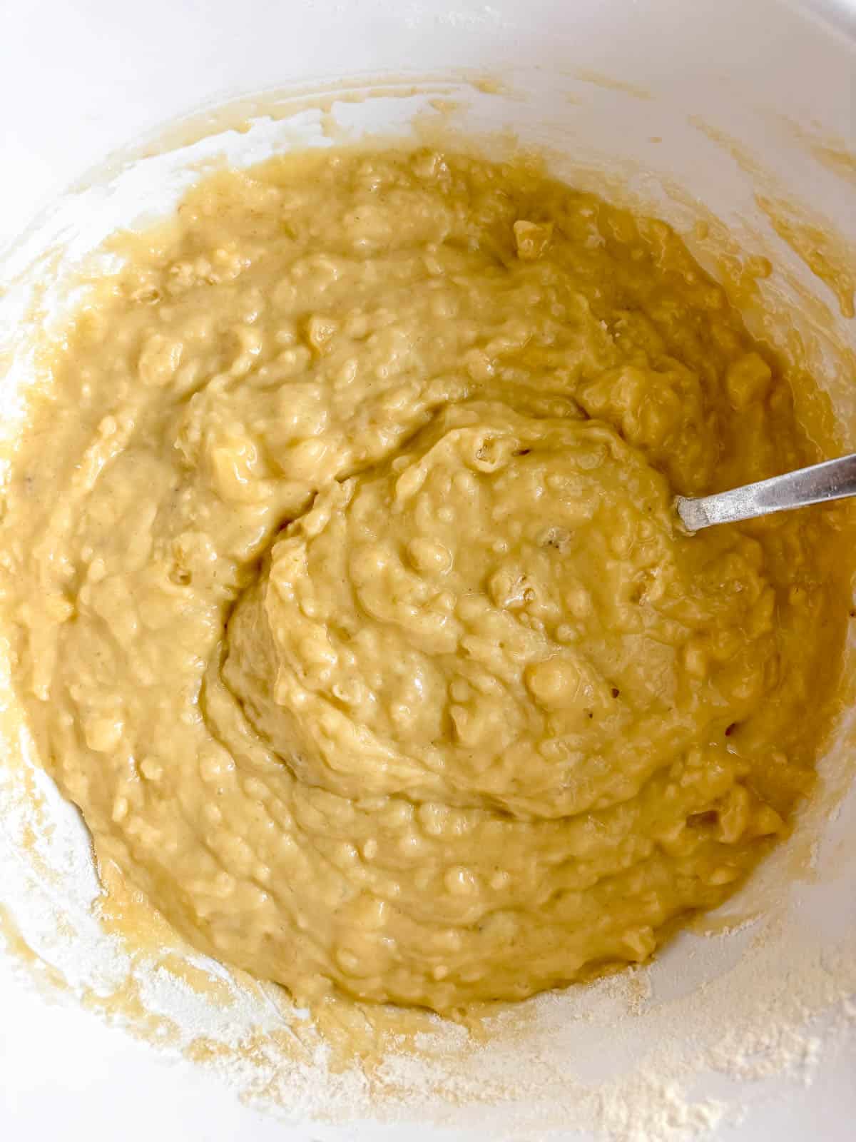 Wet and dry ingredients mixed together for strawberry banana bread.