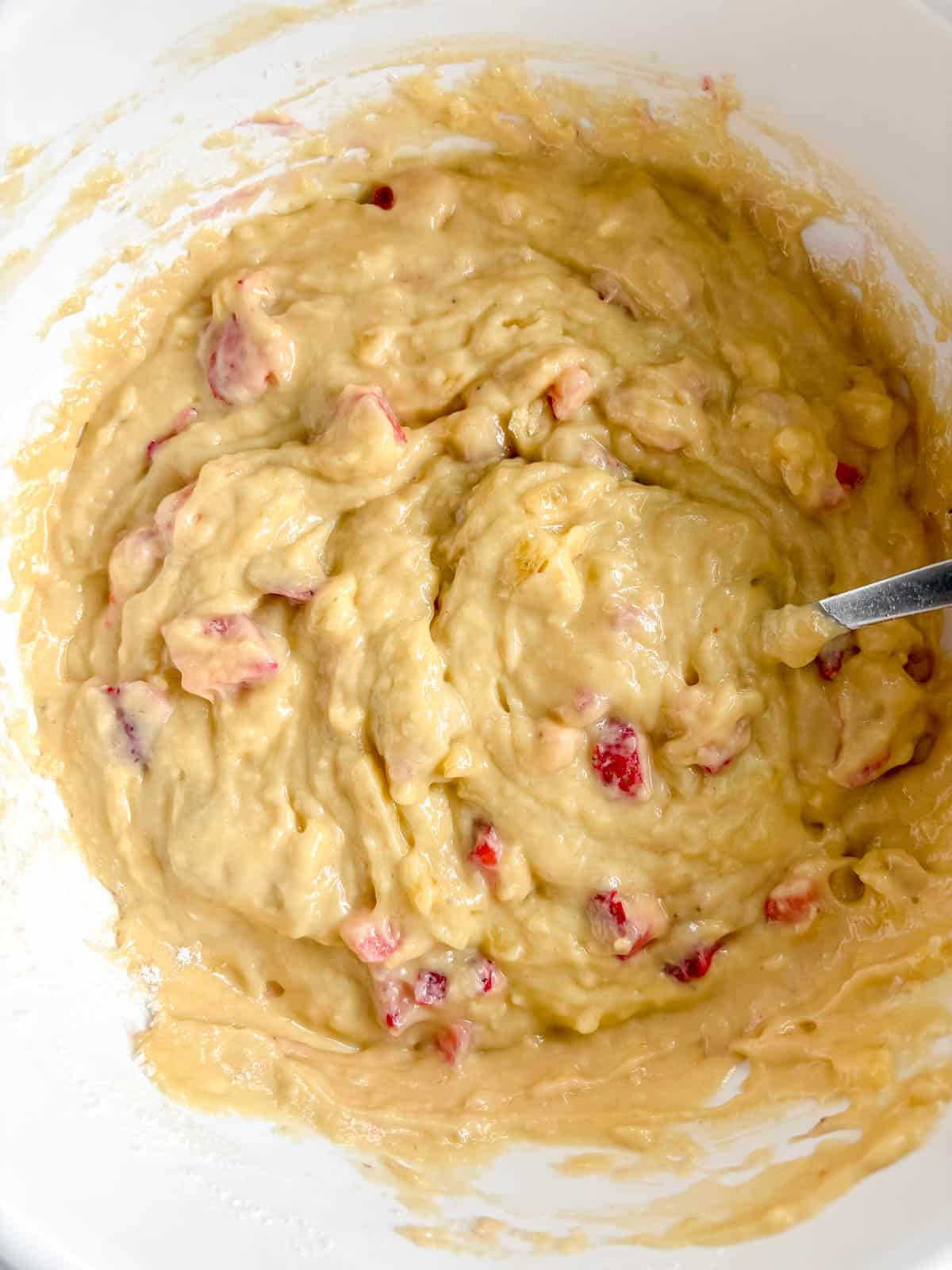 Chopped strawberries folded into the banana bread batter.