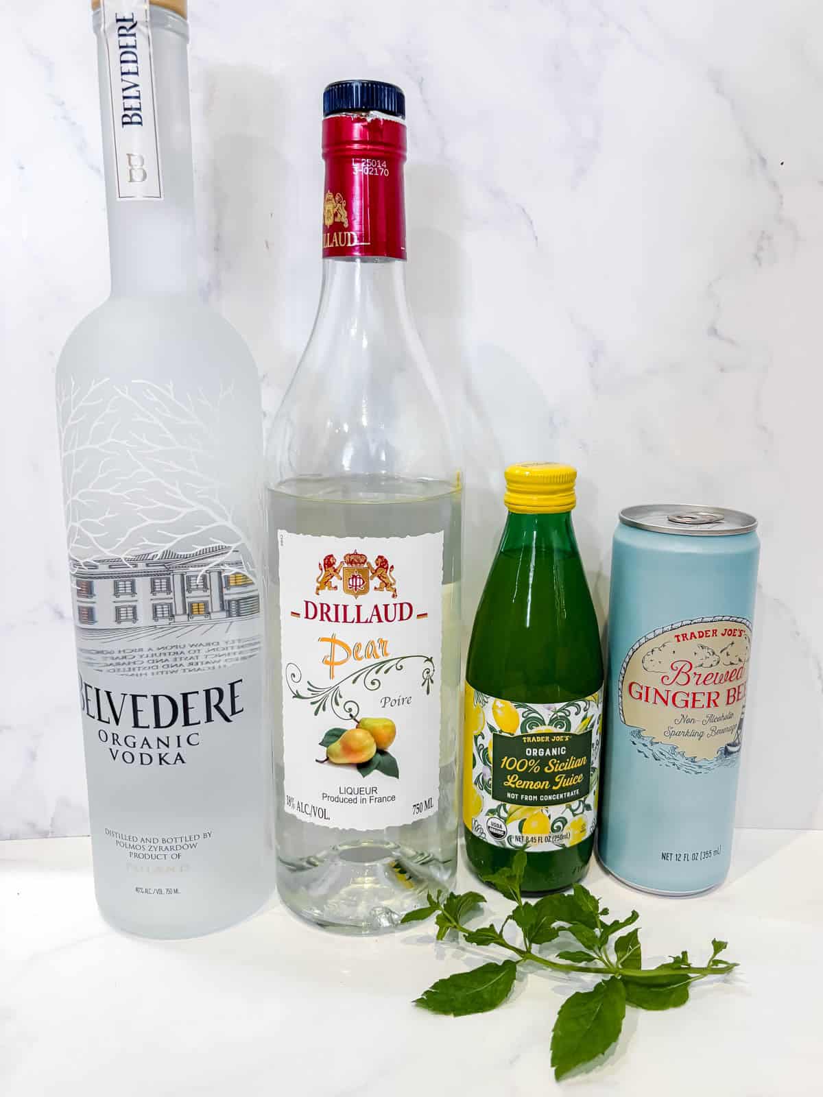 Ingredients needed to make a pear moscow mule.