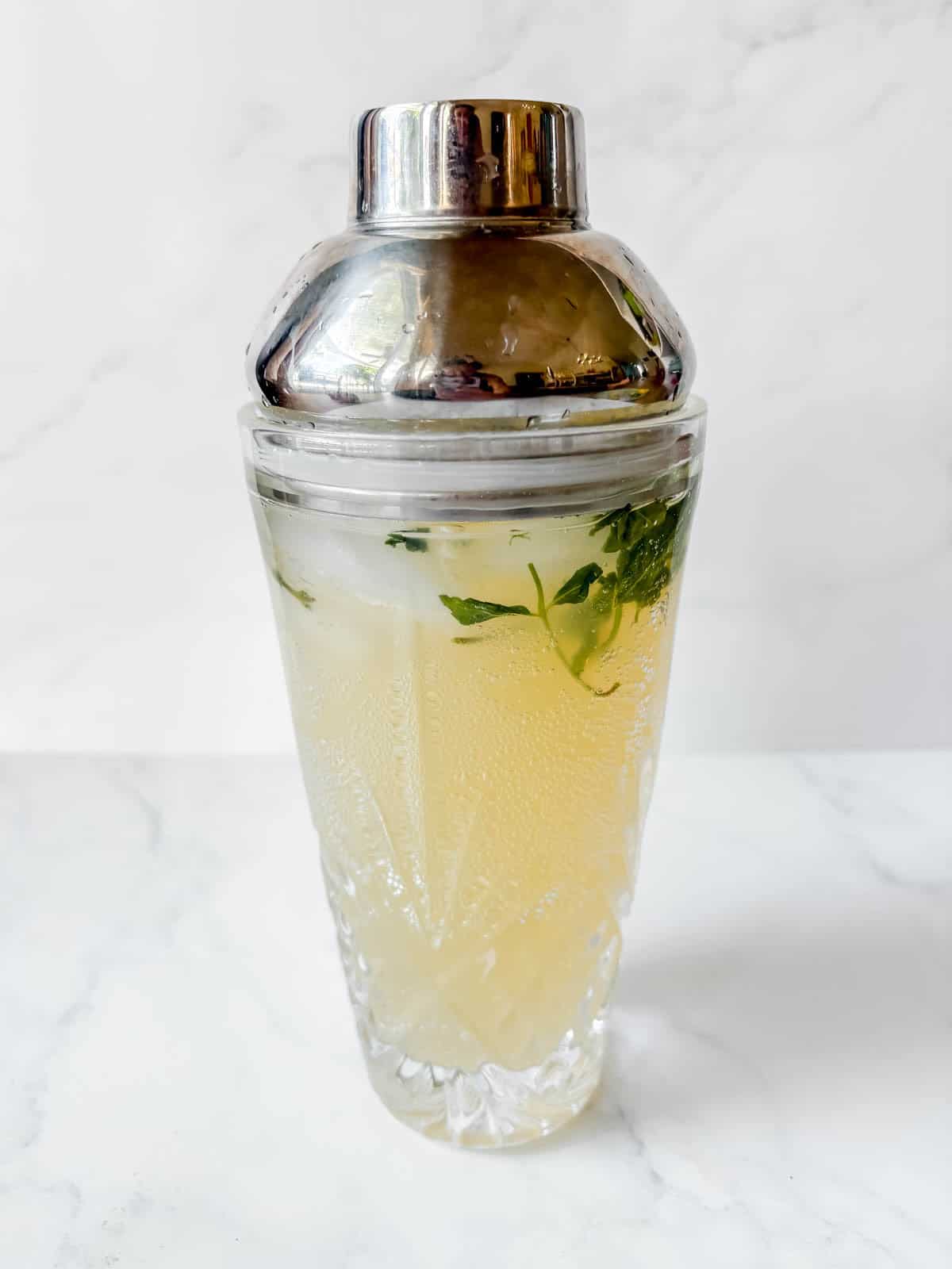 Pear liqueur cocktail mixture in the cocktail shaker.