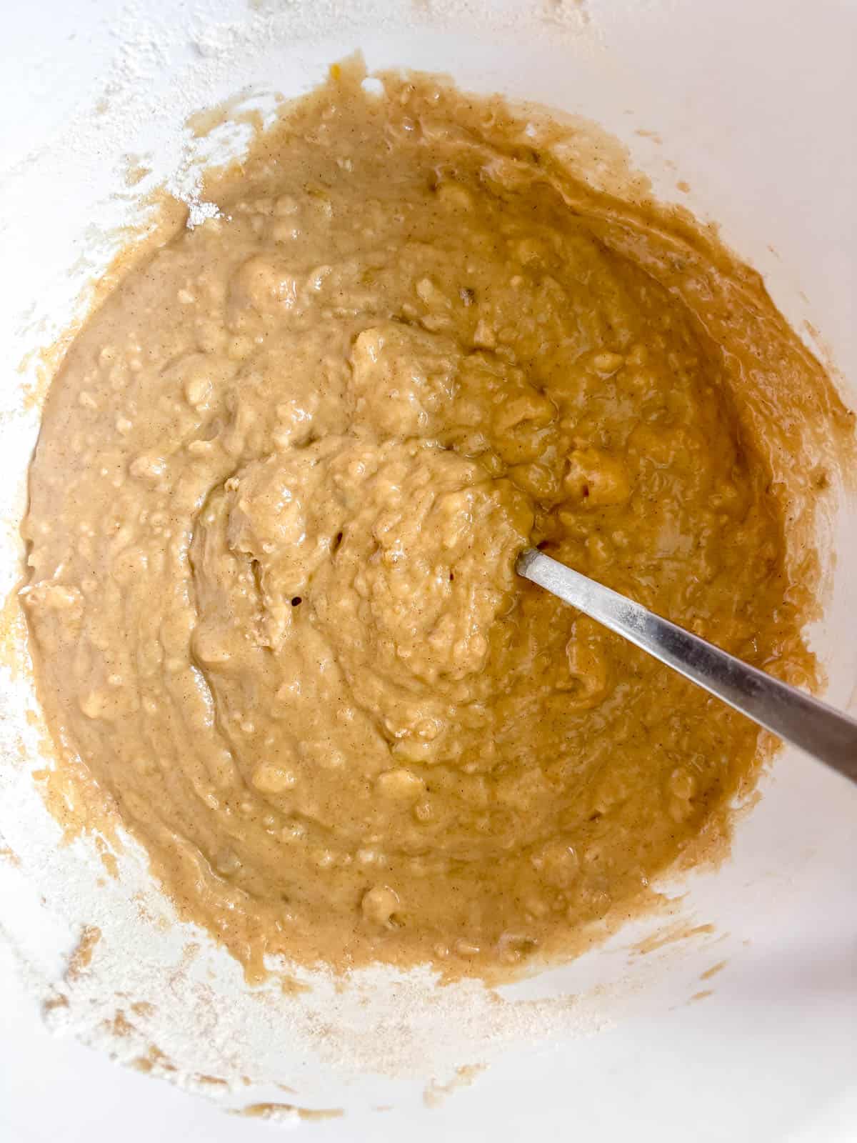 Maple banana bread batter in a bowl.