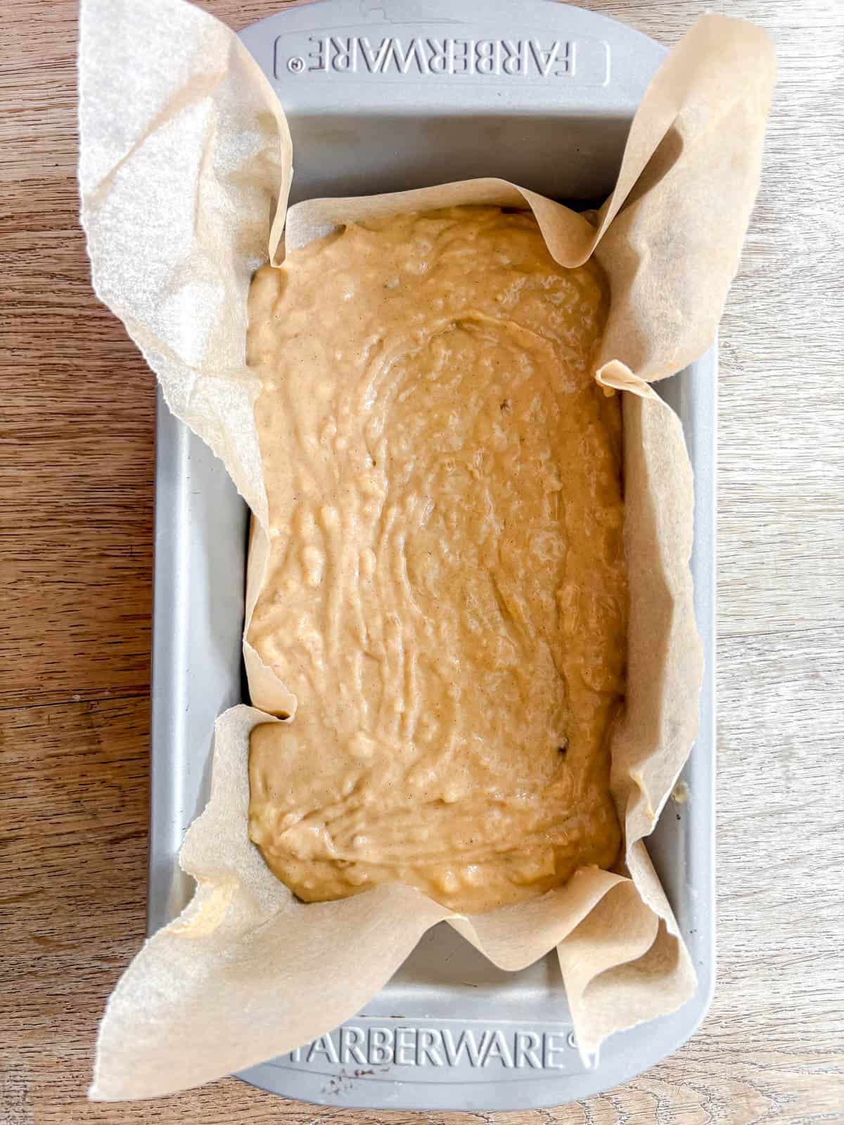 Maple banana bread in a pan before baking.