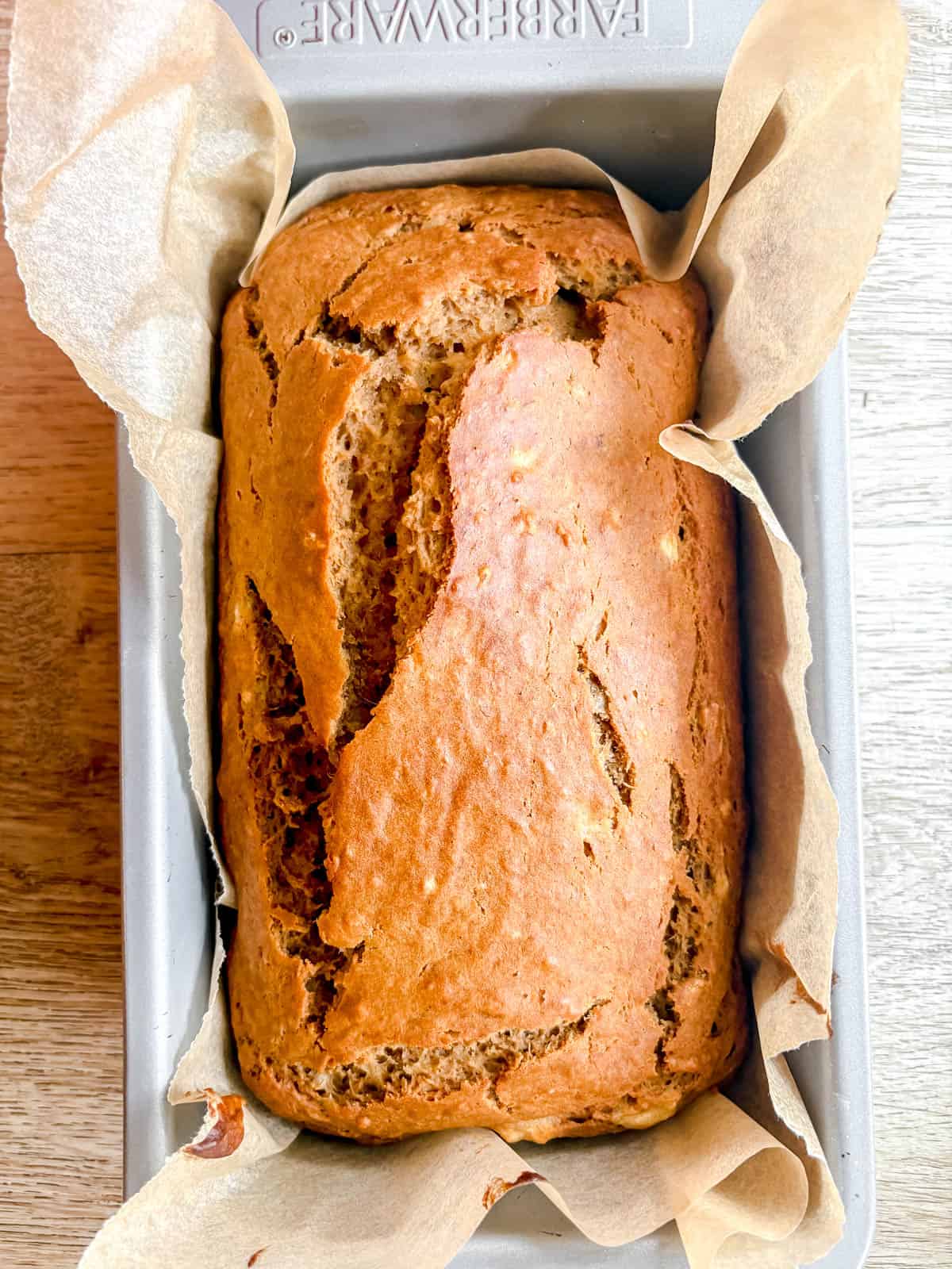 Maple banana bread in a pan after baking.