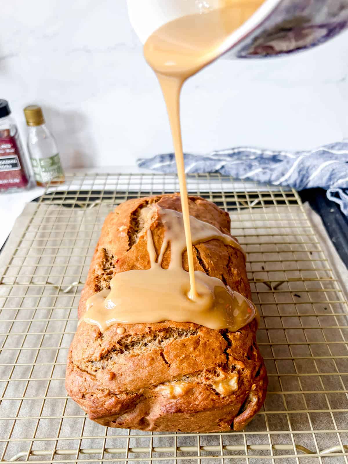 Maple glaze drizzled over banana bread.