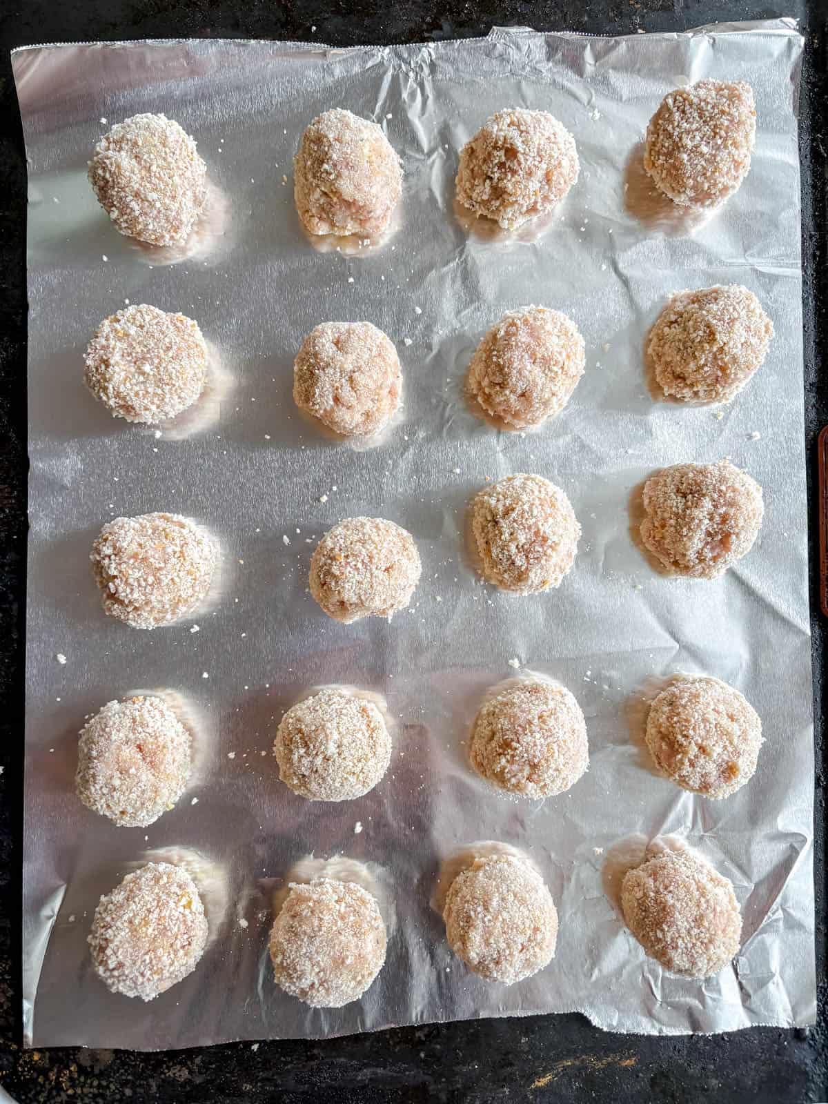 Chicken parmesan meatballs before baking.