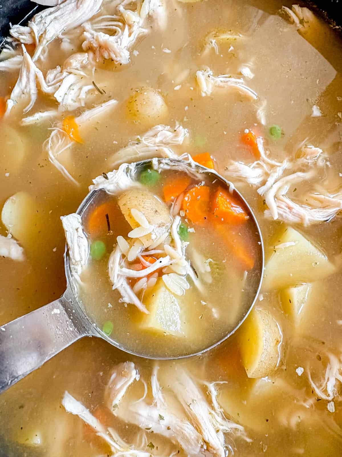 Chicken Soup with Potatoes and Orzo in a crockpot after cooking.