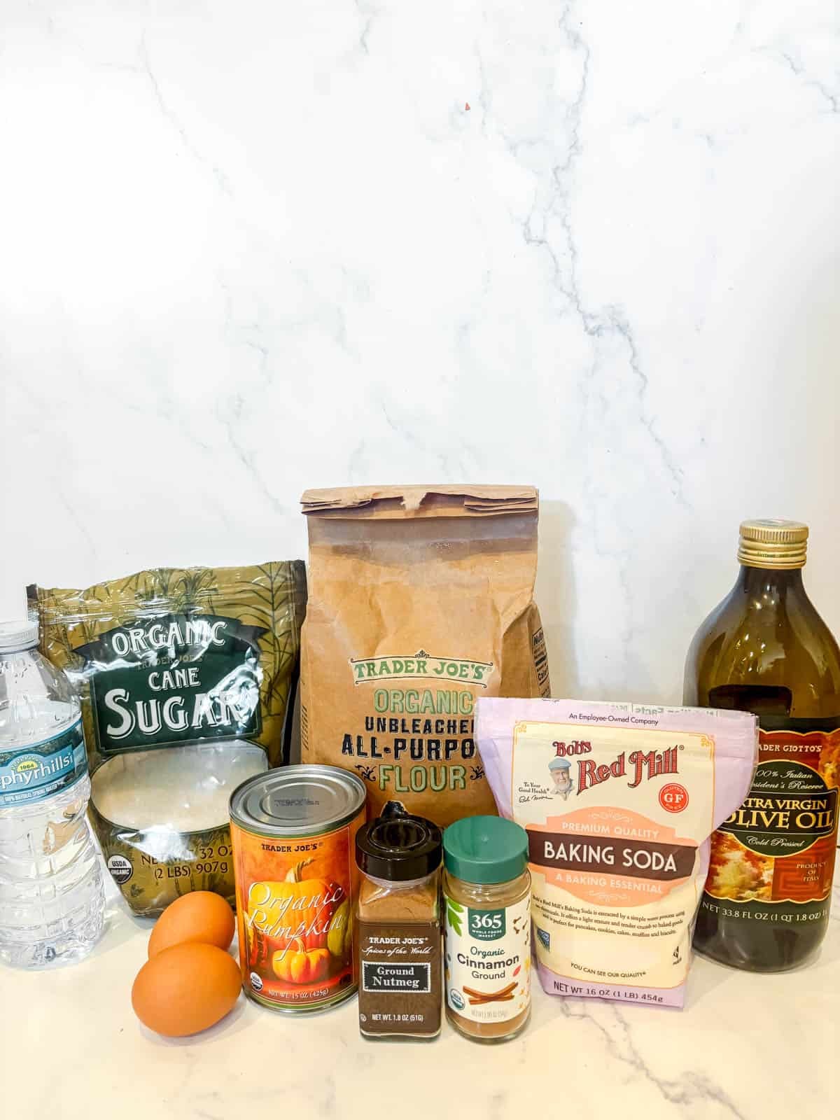 Ingredients needed to make pumpkin cranberry muffins.