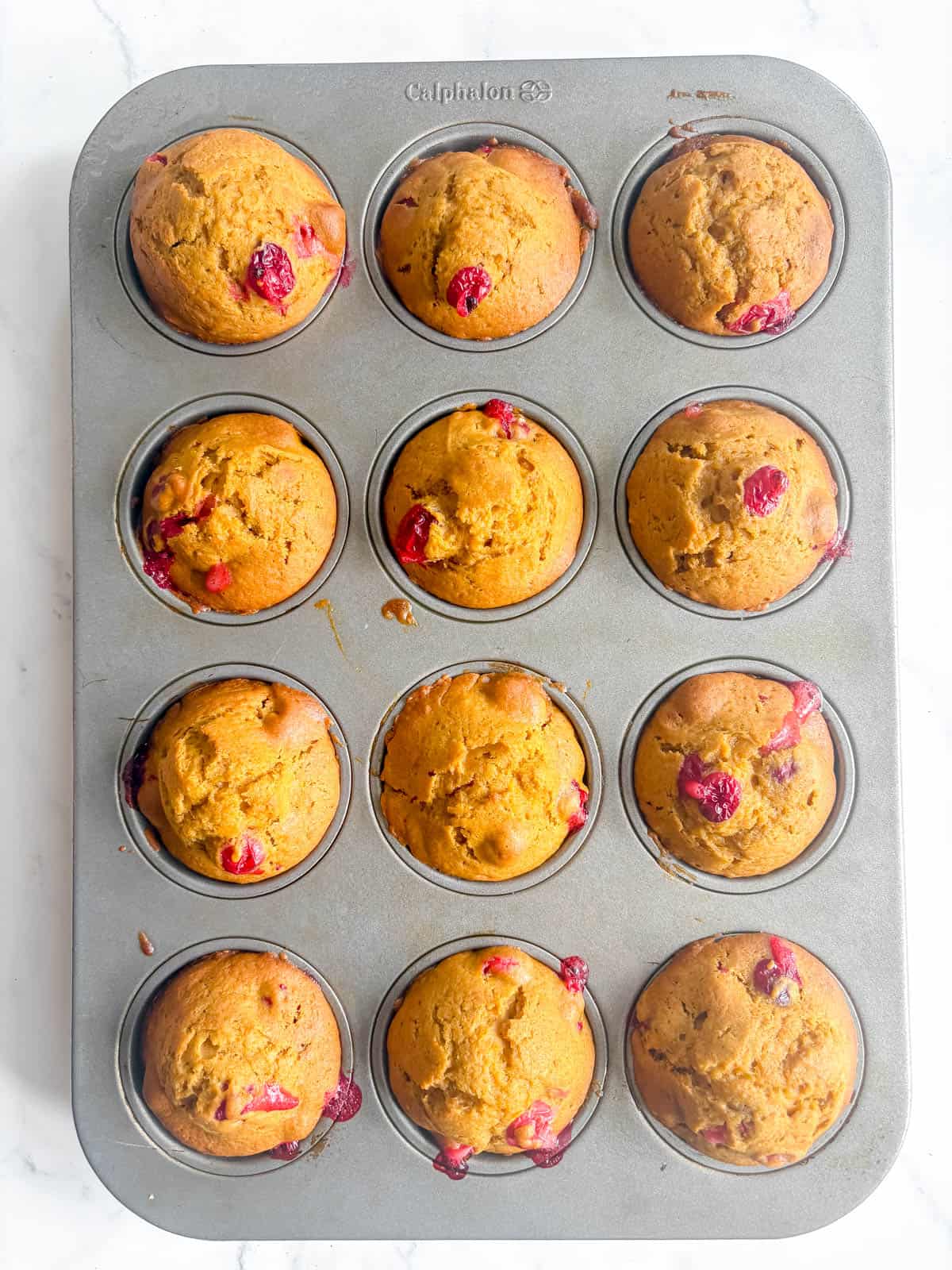 Pumpkin cranberry muffins after baking.